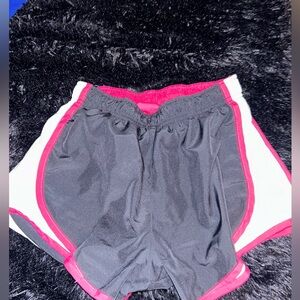 Pink and black Nike shorts